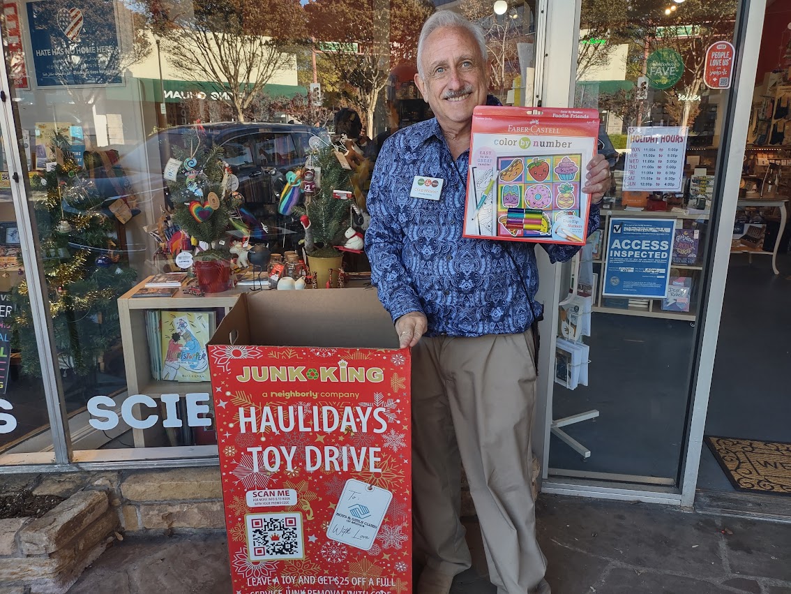 Craig Wiesner in front of store during toy drive