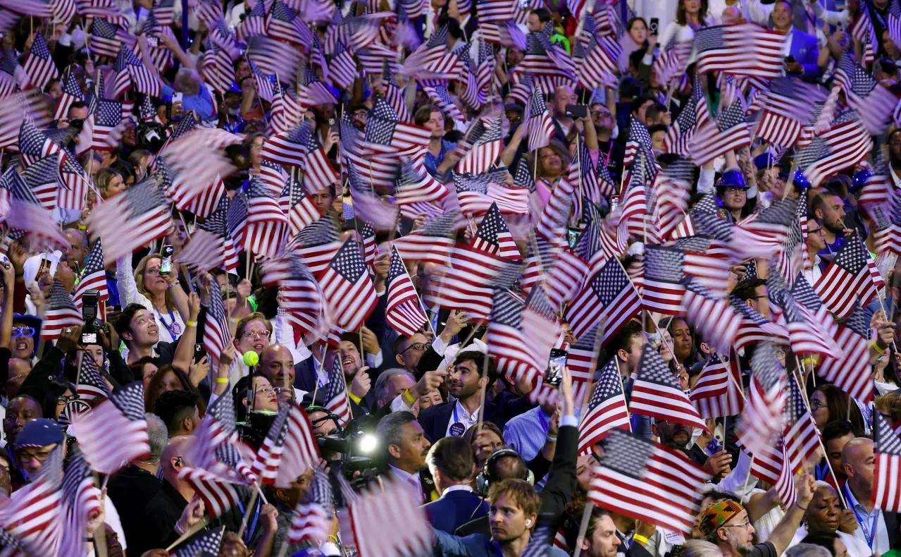 Delegates waving flags at DNC in Chicago